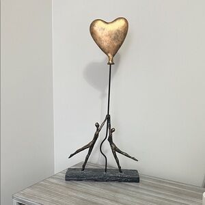 Artistic Gold Heart Sculpture with Black Base